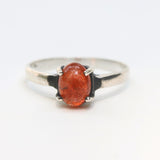 Oval cabochon sunstone ring in prongs setting with sterling silver matte finished band - Metal Studio Jewelry