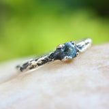 Blue topaz ring in silver bezel and prongs setting on sterling silver oxidized hard texture band - Metal Studio Jewelry