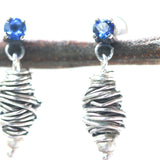 Sterling silver stud earrings with faceted blue sapphire in prongs setting with silver bird's nest - Metal Studio Jewelry