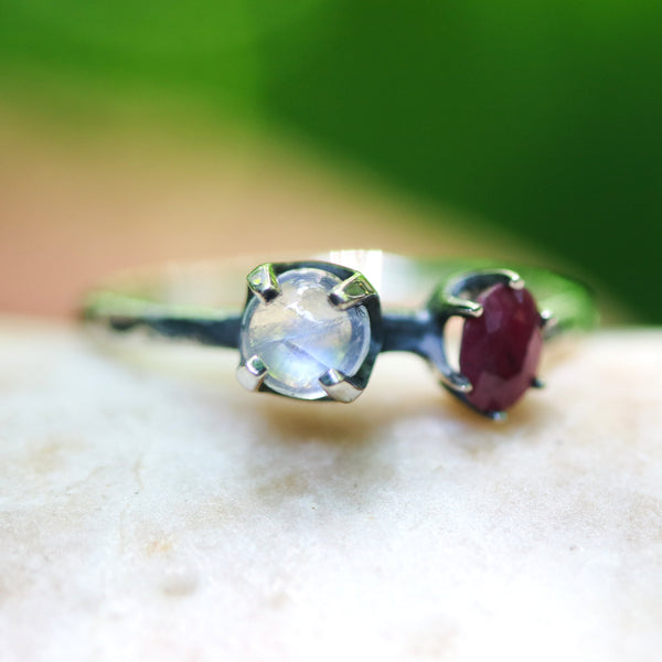 Round cabochon moonstone ring in silver bezel and prongs setting and ruby on the side with sterling silver high polish finished band - Metal Studio Jewelry