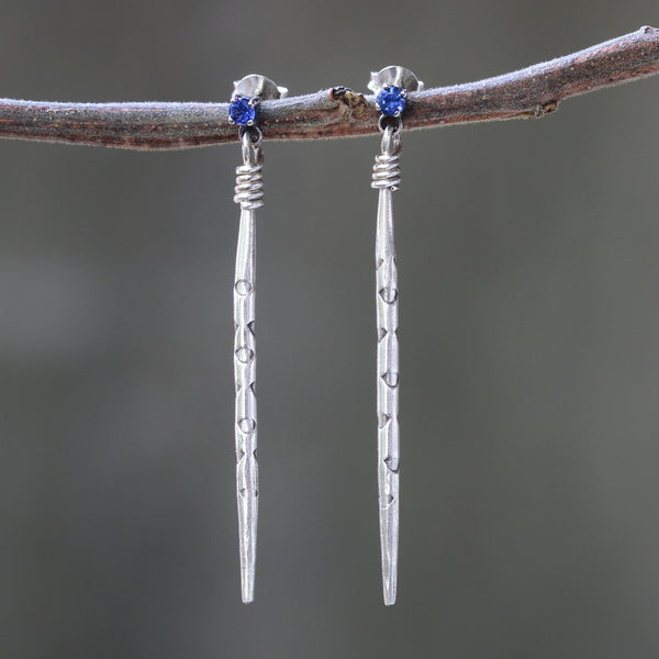 Sterling silver stud earrings with faceted blue sapphire in prongs setting and silver spike - Metal Studio Jewelry