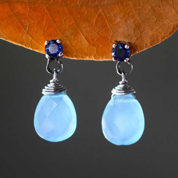 Dyed blue chalcedony teardrop faceted earrings with tiny blue sapphire on the top and sterling silver stud style - Metal Studio Jewelry