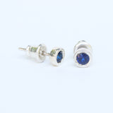Sterling silver stud earrings with faceted blue sapphire in bezel setting with sterling silver post and backing - Metal Studio Jewelry