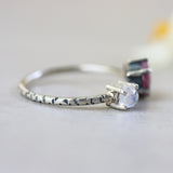 Faceted ruby ring in silver prongs setting and faceted moonstone with sterling silver texture band