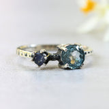 Round blue topaz ring in silver bezel and prongs setting with round moonstone - Metal Studio Jewelry