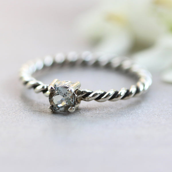 Tiny round faceted blue topaz ring in prongs setting with sterling silver oxidized twist design band - Metal Studio Jewelry