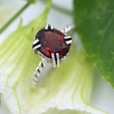 Oval Garnet ring in silver bezel and double prongs setting in silver twist design oxidized band - Metal Studio Jewelry