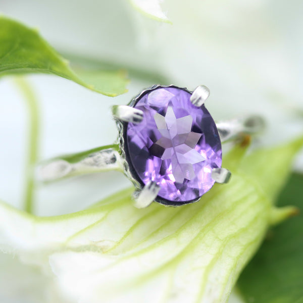 Oval faceted Amethyst ring in silver bezel and prongs setting in silver texture oxidized band - Metal Studio Jewelry