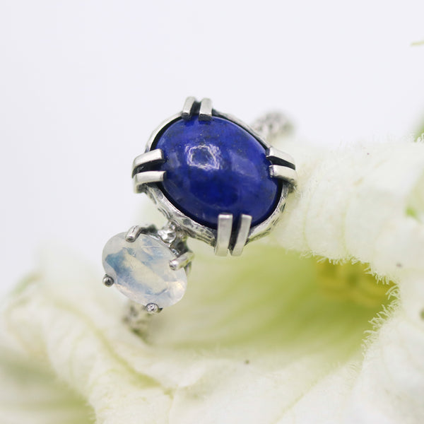 Oval faceted Lapis lazuli ring in silver bezel and prongs setting with oval moonstone on the side - Metal Studio Jewelry
