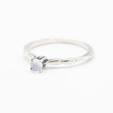 Dainty silver band with round moonstone gemstone in prongs setting - Metal Studio Jewelry