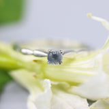 Dainty silver band with round moonstone gemstone in prongs setting - Metal Studio Jewelry