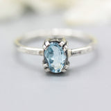 Oval Swiss blue topaz ring in silver bezel and prongs setting with sterling silver band - Metal Studio Jewelry