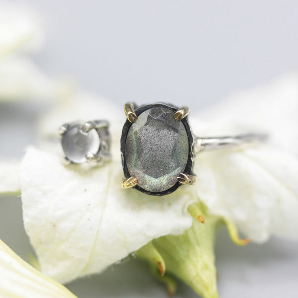 Oval labradorite ring and round tiny moonstone side set gems in prongs setting with sterling silver oxidized band - Metal Studio Jewelry