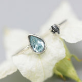 Blue topaz ring and rough diamond in silver bezel and prongs setting with sterling silver band