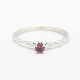 Dainty silver band with faceted round pink tourmaline gemstone in prongs setting - Metal Studio Jewelry