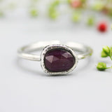 Red faceted ruby ring in silver bezel setting with sterling silver matte finish band - Metal Studio Jewelry