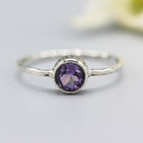 Round faceted amethyst ring in silver bezel setting with sterling silver band - Metal Studio Jewelry