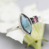 Marquise labradorite ring with tiny pink tourmaline on the side with sterling silver oxidized texture band - Metal Studio Jewelry