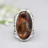 Oval orange/brown Lace agate ring in silver bezel setting with sterling silver skeleton multi wrap band - Metal Studio Jewelry