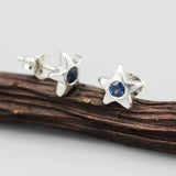 Star shape stud earrings with faceted blue sapphire in bezel setting with sterling silver post and backing - Metal Studio Jewelry