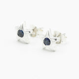 Star shape stud earrings with faceted blue sapphire in bezel setting with sterling silver post and backing - Metal Studio Jewelry