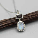 Oval cabochon moonstone pendant necklace in silver bezel setting and rectangle garnet on the top - Metal Studio Jewelry