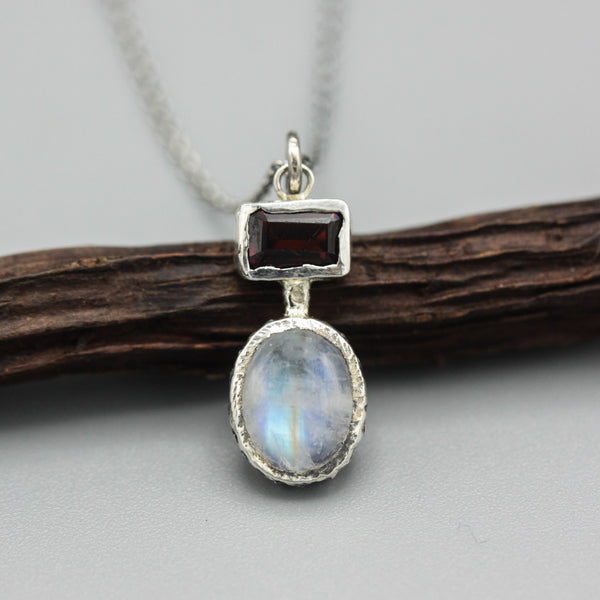 Oval cabochon moonstone pendant necklace in silver bezel setting and rectangle garnet on the top - Metal Studio Jewelry