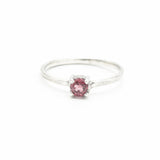 Tiny round garnet ring in prongs setting with sterling silver scratch texture band