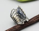 Blue sapphire ring in silver bezel setting and sterling silver skeleton multi wrap with hammer textured band - Metal Studio Jewelry