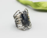 Blue sapphire ring in silver bezel setting and sterling silver skeleton multi wrap with hammer textured band - Metal Studio Jewelry