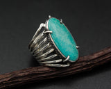 Oval Turquoise ring in silver bezel setting with sterling silver skeleton multi wrap and hammer textured band - Metal Studio Jewelry