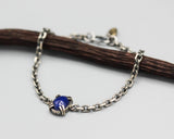 Oval lapis lazuli bracelet in silver bezel and double prongs setting and oxidized sterling silver in cable design chain