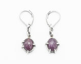 Pink sapphire oval faceted earrings in bezel and prongs setting with silver chain on oxidized sterling silver hooks