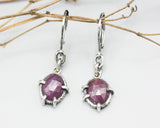 Pink sapphire oval faceted earrings in bezel and prongs setting with silver chain on oxidized sterling silver hooks
