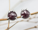 Tiny ruby stud earrings in bezel and prongs setting with sterling silver post and backing - Metal Studio Jewelry
