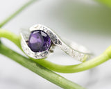 Bypass style ring sterling silver hammer texture with round faceted Amethyst at the center
