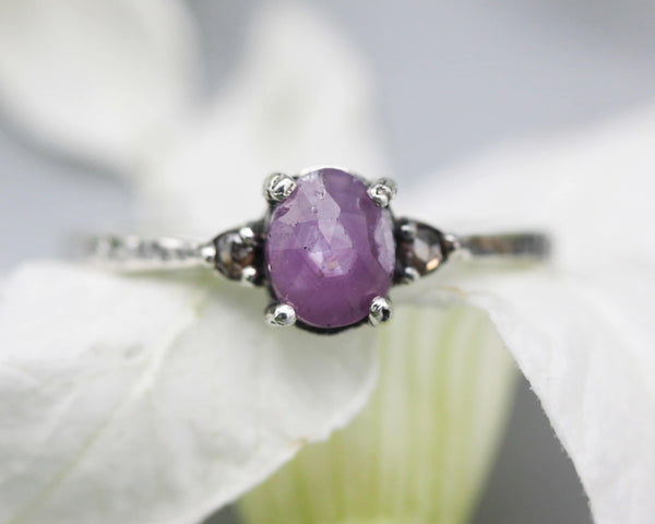 Pink sapphire ring in prongs setting and twin side set champagne diamonds with sterling silver texture band