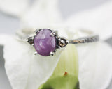 Pink sapphire ring in prongs setting and twin side set champagne diamonds with sterling silver texture band
