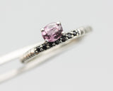 Oval faceted pink tourmaline ring in prongs setting with tiny black spinel on sterling silver oxidized line texture design band