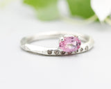 Oval faceted pink tourmaline ring in prongs setting with tiny champagne diamonds on sterling silver geometric texture design band