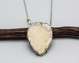 Yellow druzy pendant necklace in silver bezel and brass prongs setting with yellow sapphire beads on the side