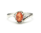 Cabochon sunstone ring with diamonds side set gems in prongs setting with sterling silver texture band