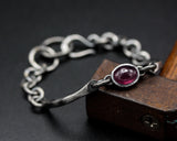 Oval cabochon natural ruby bracelet in silver bezel setting and sterling silver oxidized chain