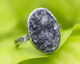 Oval black Brazilian raw druzy ring in silver bezel setting with sterling silver oxidized texture design band