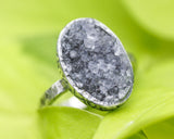 Oval black Brazilian raw druzy ring in silver bezel setting with sterling silver oxidized texture design band