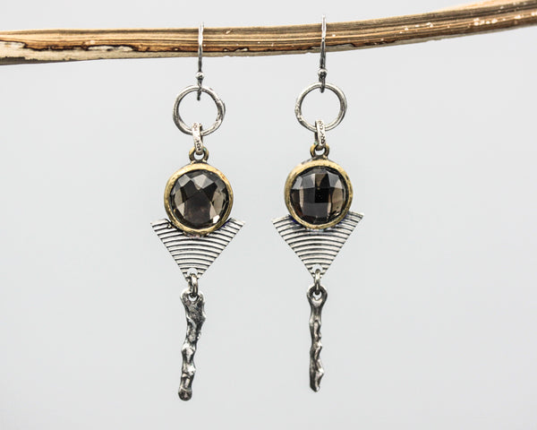 Earrings round faceted smoky quartz in brass bezel setting with silver triangle and silver stick on oxidized sterling silver hooks style
