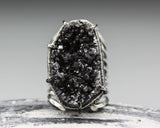 Large black Brazilian raw druzy ring in silver bezel and prongs setting with silver skeleton band