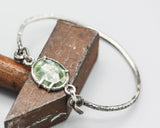 Bangle bracelet oval green kyanite in silver bezel and prongs setting with oxidized sterling silver with texture band