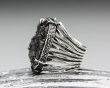 Black druzy ring in silver bezel and prongs setting with sterling silver skeleton multi wrap band