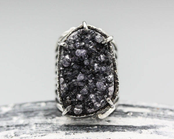 Large purple druzy statement ring in silver bezel and prongs setting with sterling silver skeleton band